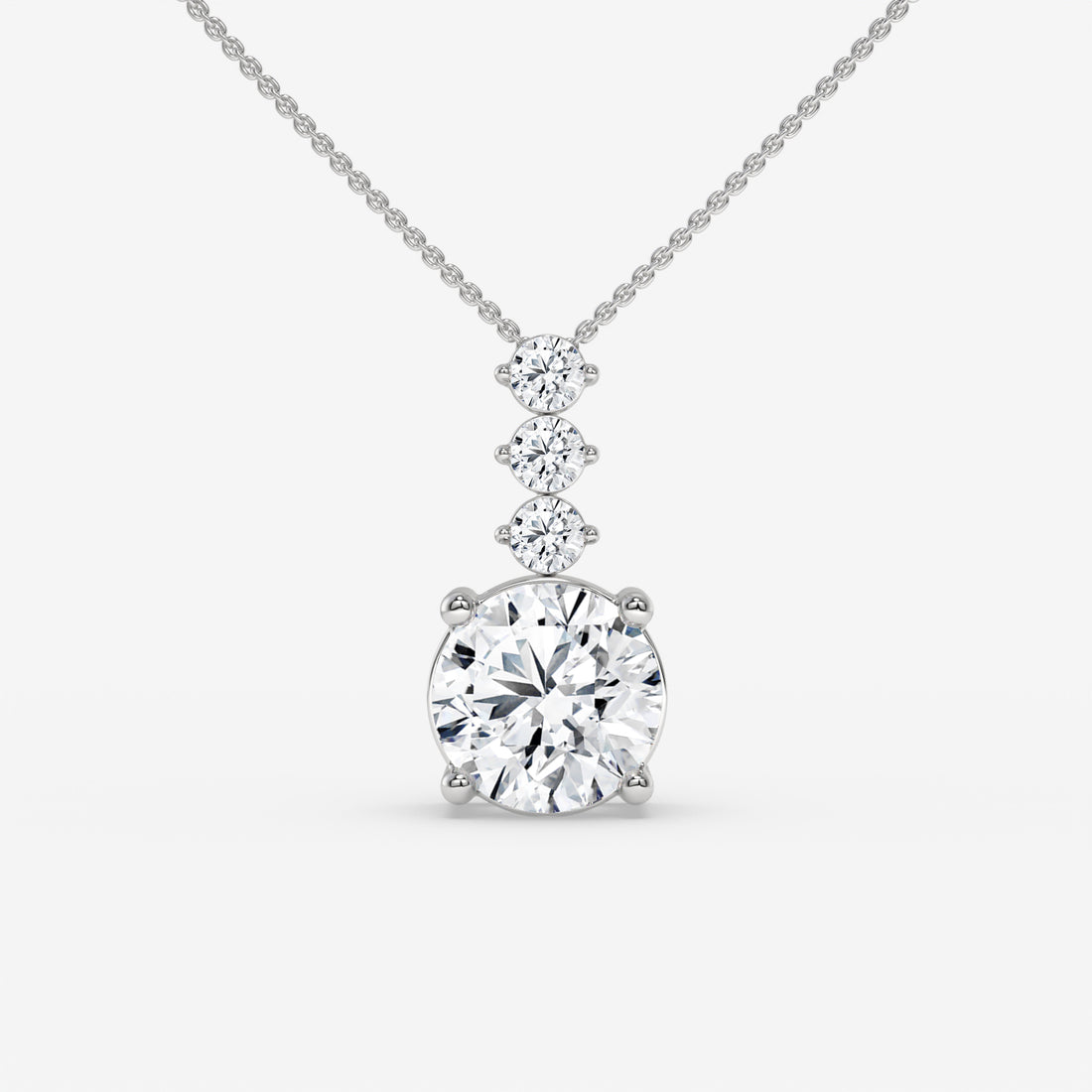 Radiant Three-Stone Round-Cut White Gold Diamond Pendant