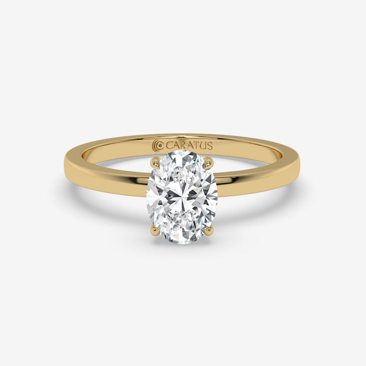 Yellow Gold Oval Diamond Ring with Round Side Stones