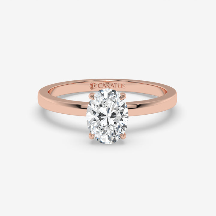 Rose Gold Oval Diamond Ring with Round Side Stones
