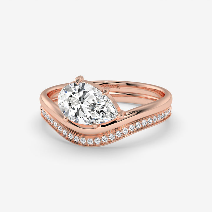 Pear-Shaped Diamond Ring with Round Diamonds in Rose Gold