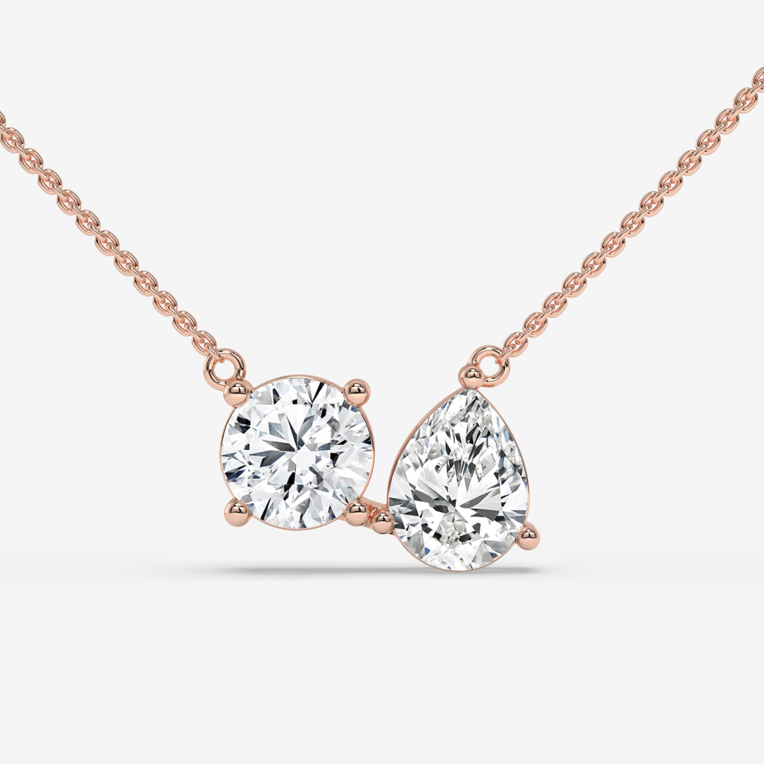 Pear and Round Duet Pendant in White Gold